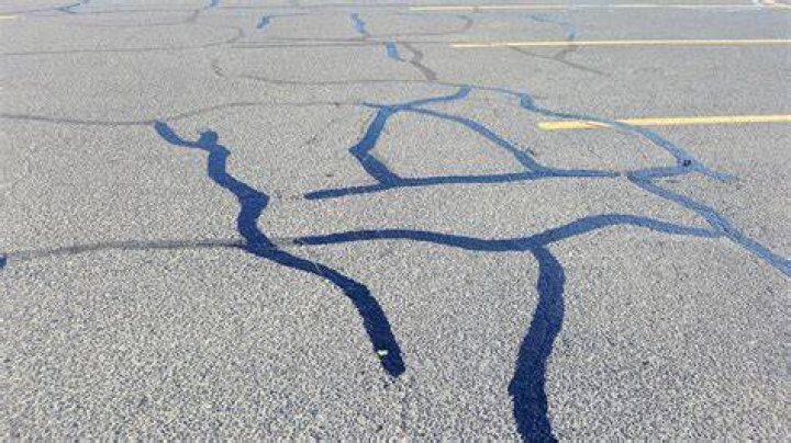 How do you remove a stripe from a parking lot?
