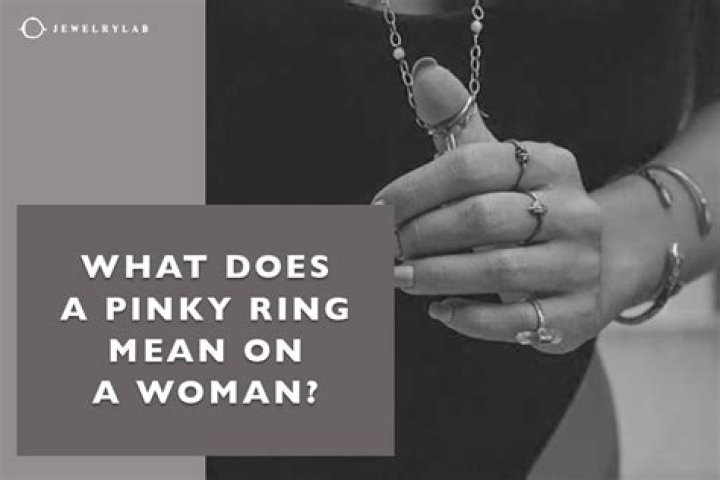 What does a right pinky ring mean on a woman?