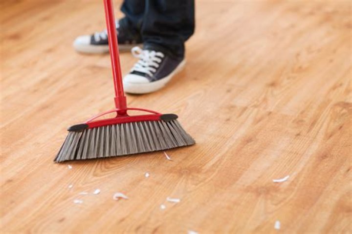 What tools are used to sweep dirt on floor?