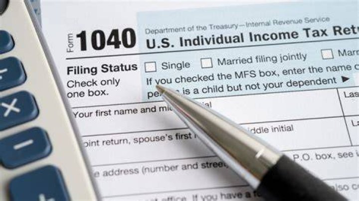Who is responsible to file and pay income tax after death?