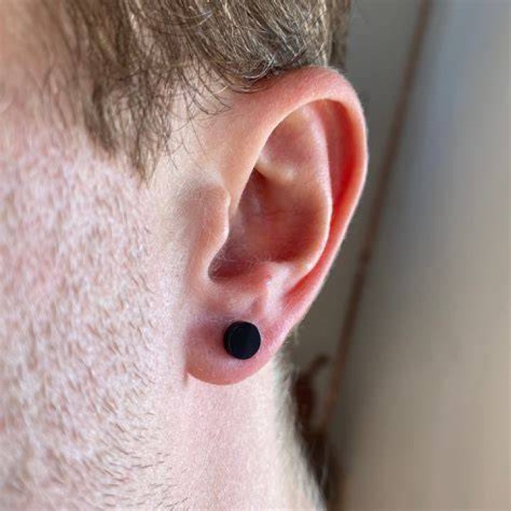Why do my ears turn black with sterling silver earrings?